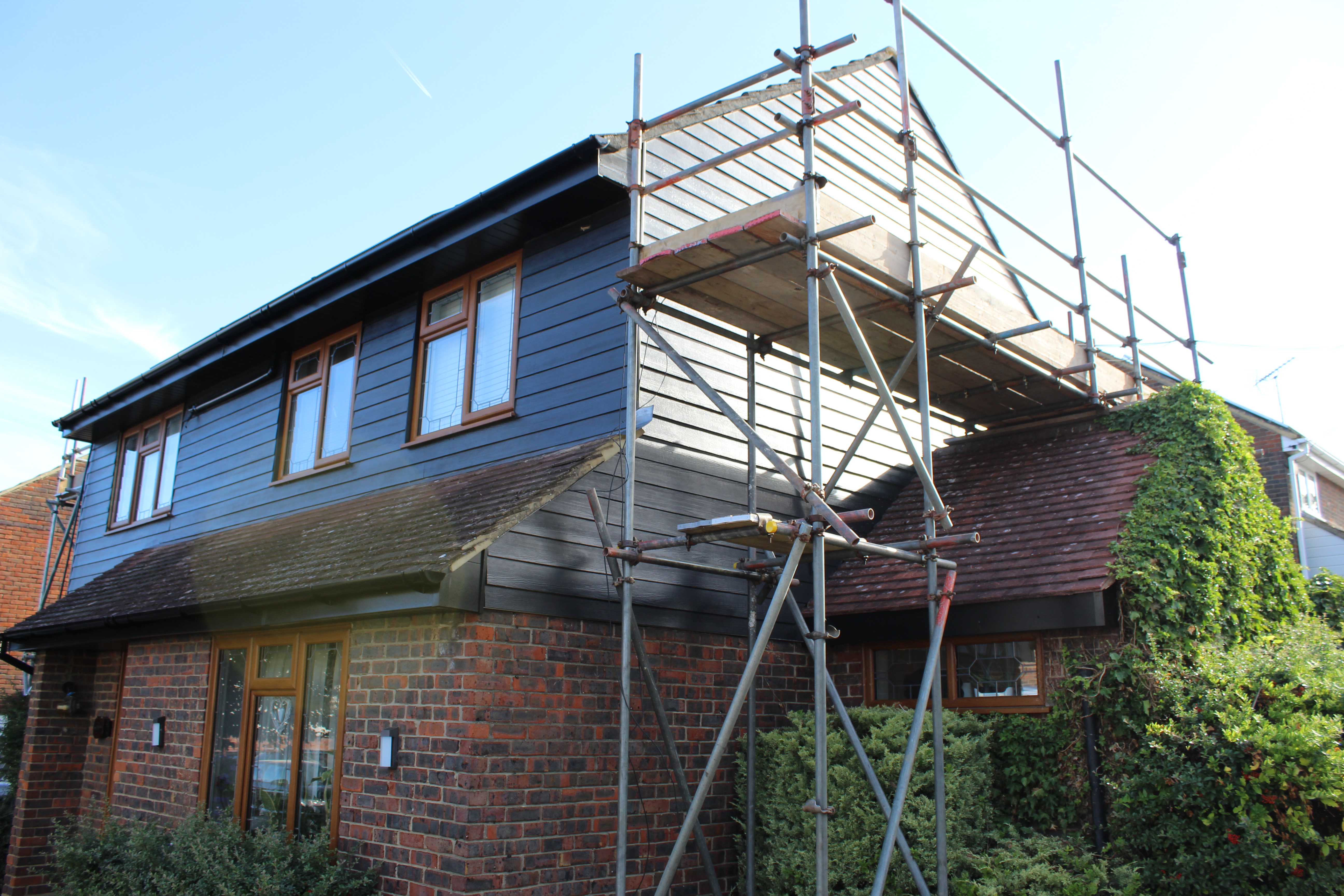 External cladding installation with scaffolding